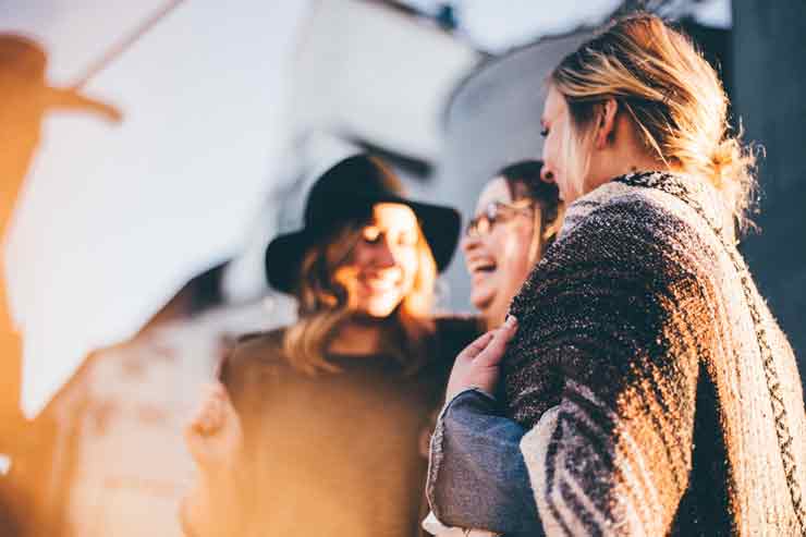Parm's Yoga | Personal Growth | Nurturing Your Mind: A Comprehensive Guide on How to Journal for Mental Health Image of 3 women laughing and moving with the flow of life.